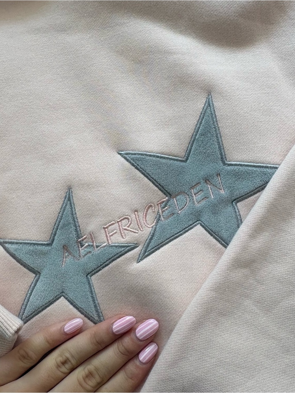 Aelfric Eden Pale Pink Crewneck Sweater with Blue Star Appliqués